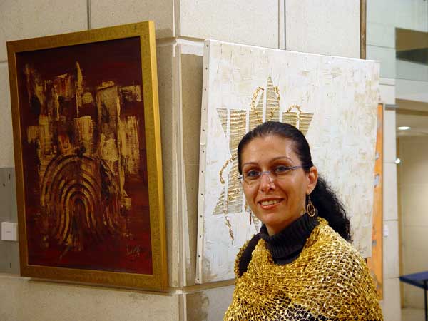 Einat and her works at the exhibition